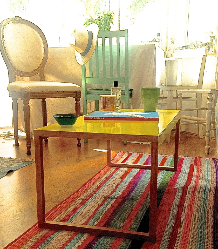 Regency chair: ENO, White chair: Mary Magdalene Foundation, Coffee table: Habitat, Striped rug: Mary Magdalene Foundation, Small bowl: Jackie Giron, Green beaker: Brixton Road charity shop